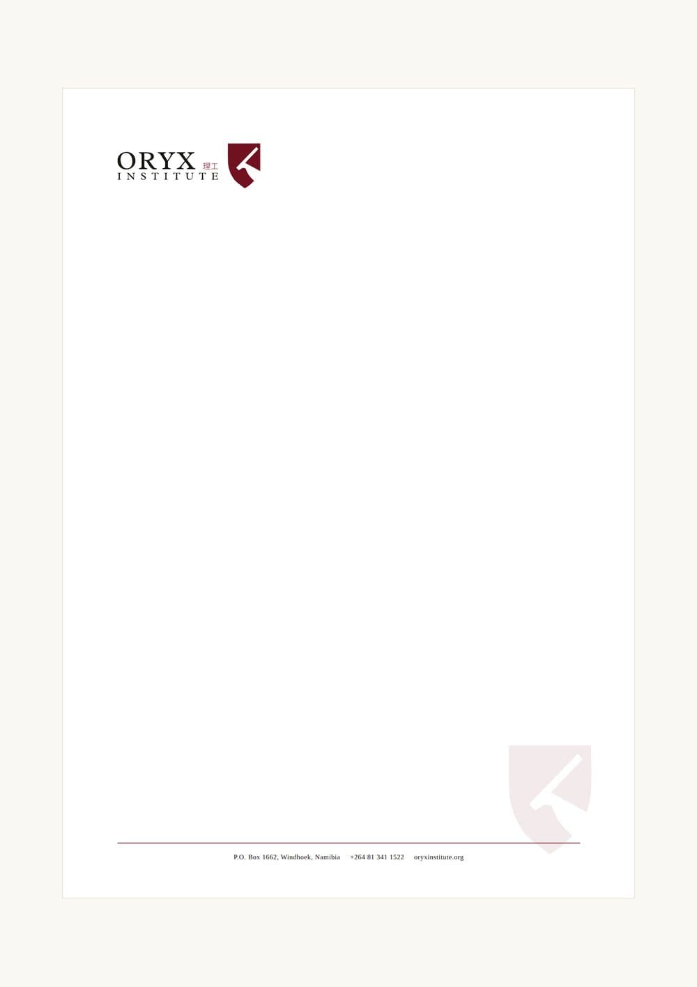 The letterhead: lockup top left, shield watermark, contact rule at the foot